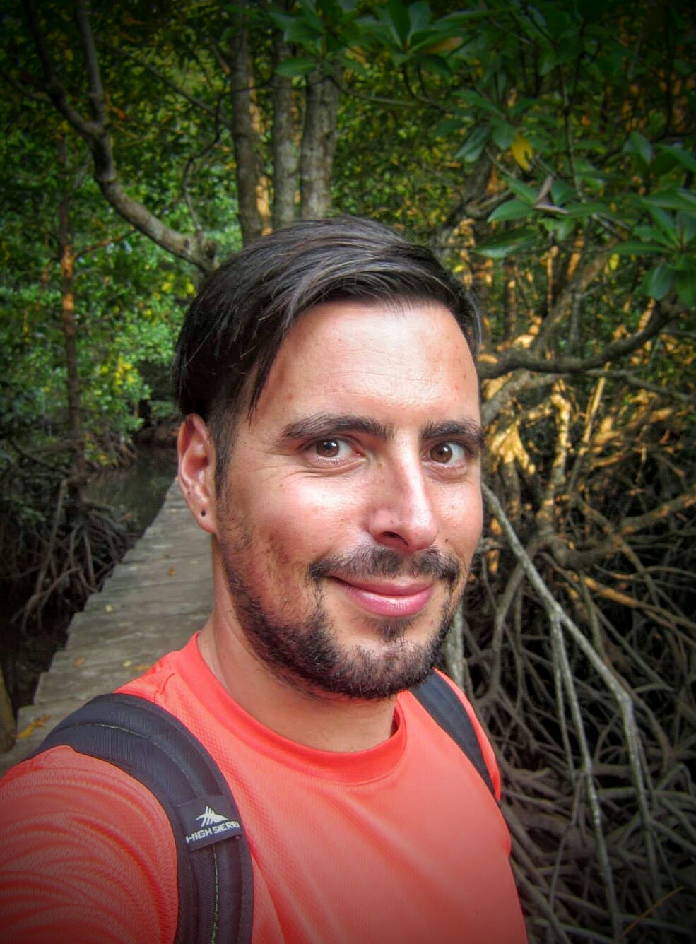 Sotiris Falieris, smiling in a mangrove forest